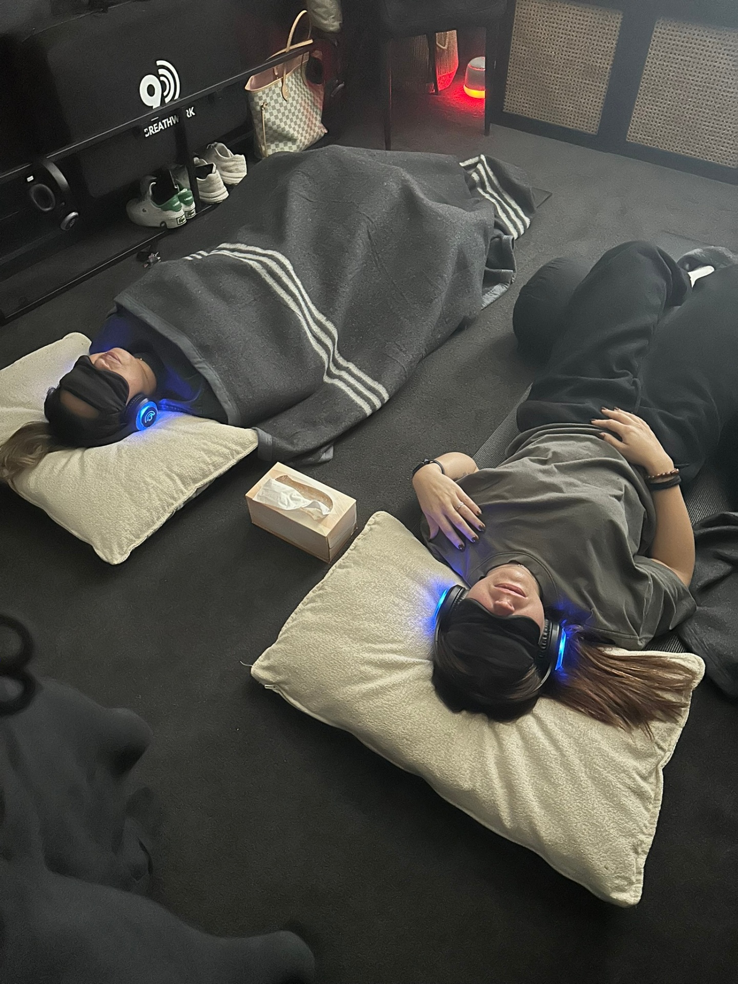 Two clients in a semi-private breathwork session