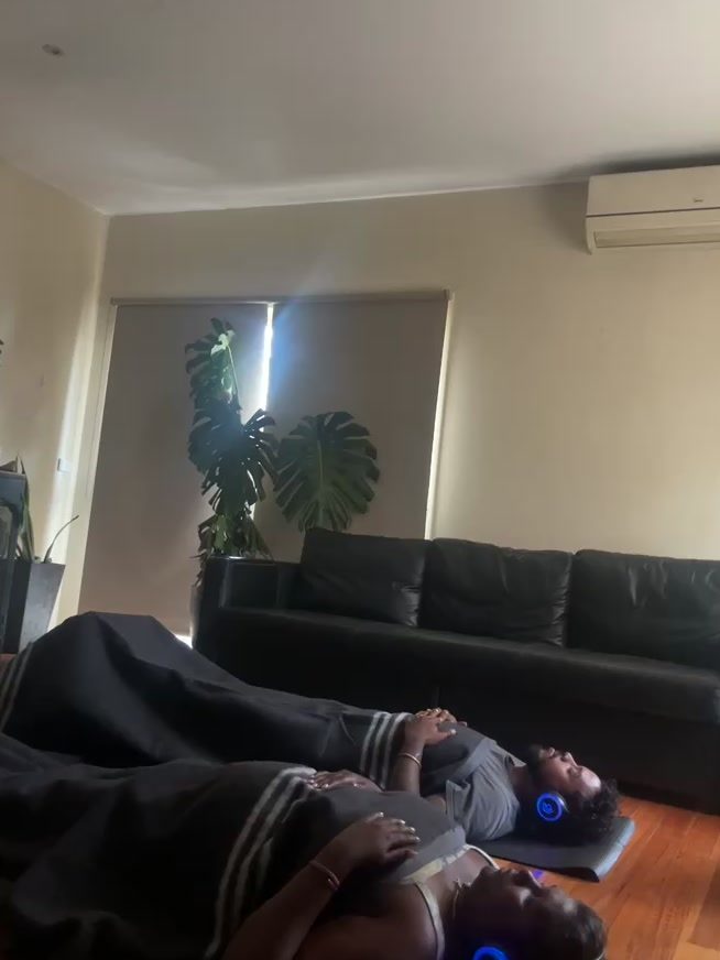 Client resting during a private 9D breathwork session